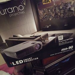 Murano projector mn-90 brand new never used still in box with brand new projector 72in screen will not entertain low ballers u no what this stuff cost