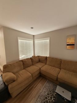 Light brown/tan microfiber sectional sofa with chaise