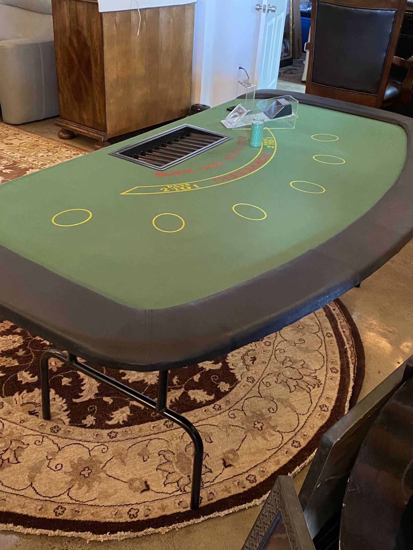 Blackjack table with fold up legs. Card shoe chip holder and some chips included.