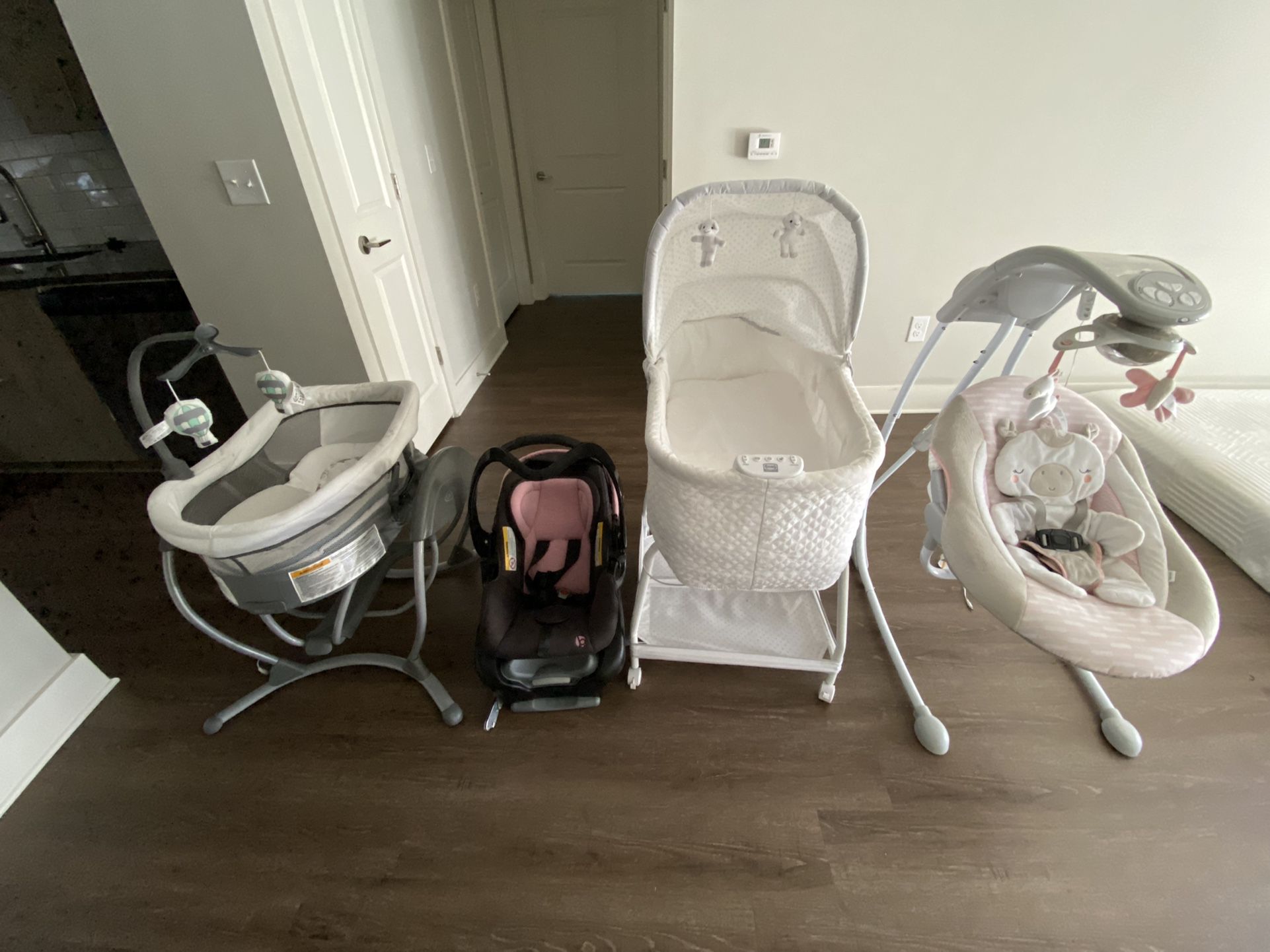 Baby swing, baby car seat, baby auto glide bassinet and cradle swing