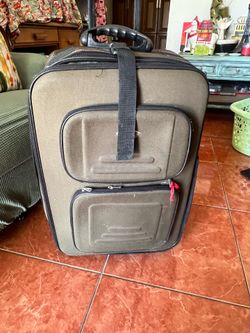 olive-green  rolling suitcase features a retractable handle and durable exterior pockets.