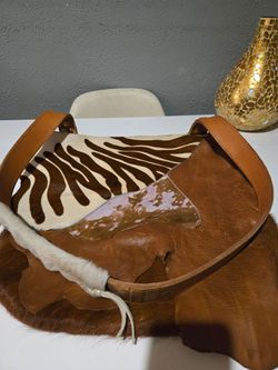 BOLSA O CARTERA COMO LE LLAMEN DE PUEL DE VACA Y SEBRA