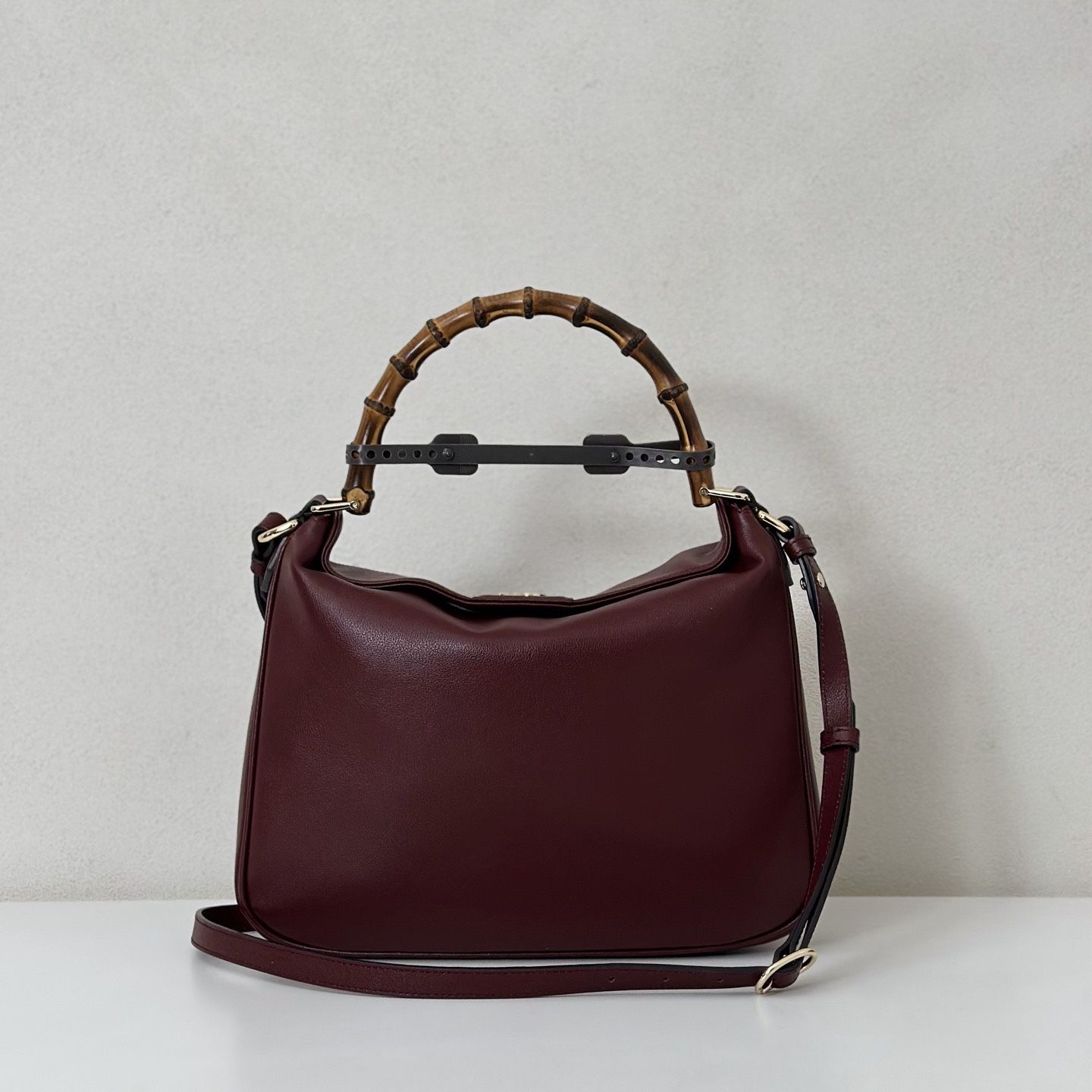 A wine-colored handbag