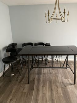 2024 Hardwood And Glass Dining Table And 6 Real Leather Chairs With Integrated Wine Bottle And Glass Storage Originally $2000