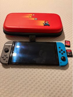 Nintendo Switch and Mario Case and 2 Games