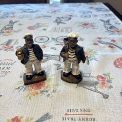 Two resin figurines of sea captains