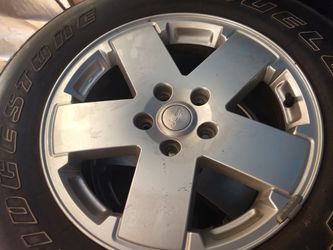 Factory rims and tires off a Jeep Wrangler jk