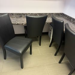 8 Faux leather chairs
