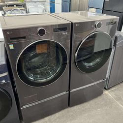  LG 5.0 cu. ft. Stackable Front Load Washer & 7.4 cu. ft. Vented Gas Dryer