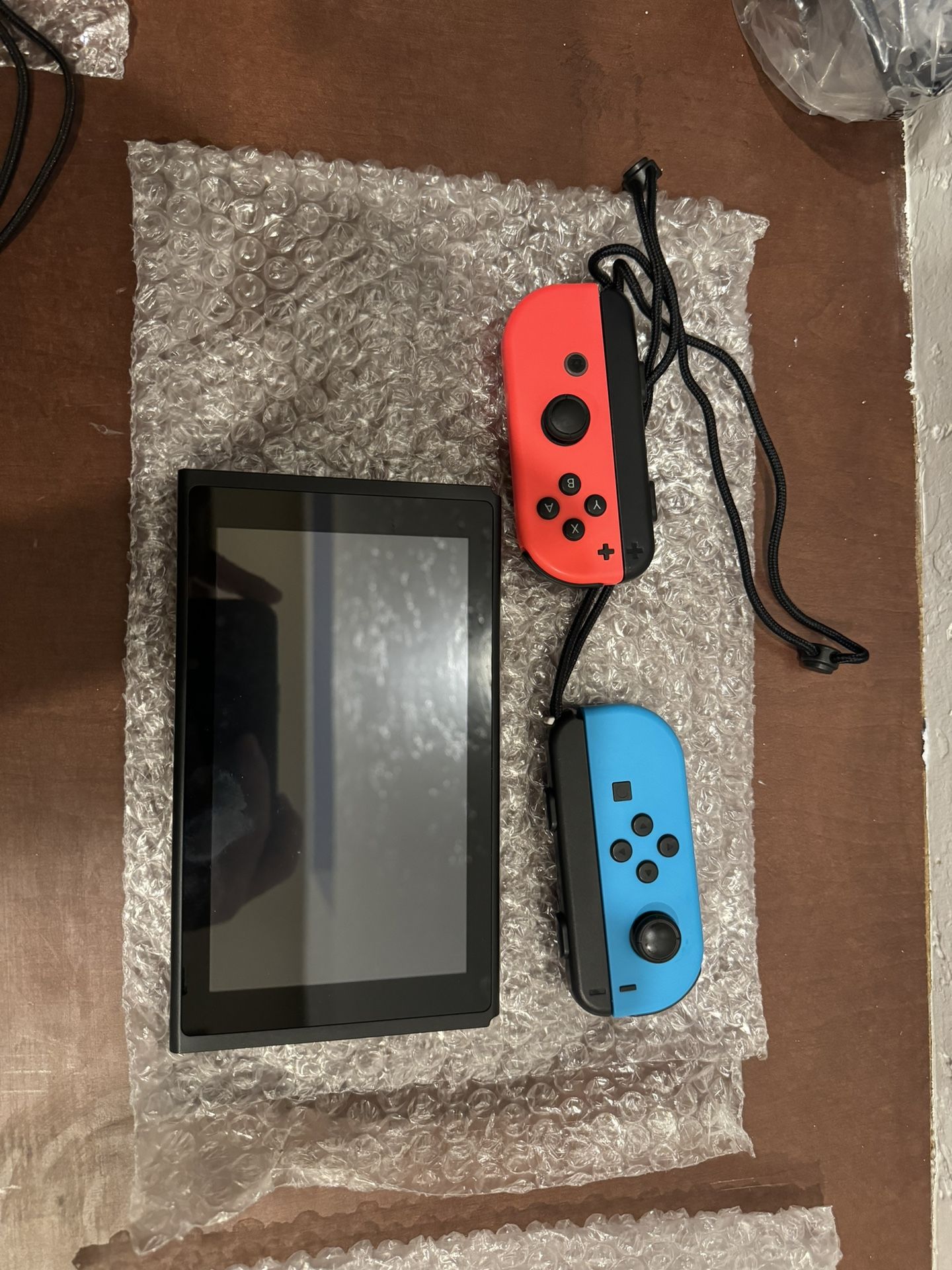 Brand New Blue And Red Nintendo Switch With Wrist Strap