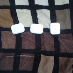 Three Airpods  Two Second Gen And One First Gen 