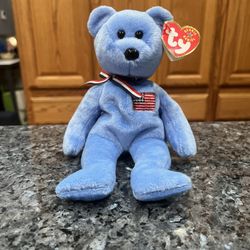 Ty Beanie “America”  The Bear 2001 Retired Plush Toy.  Brand new with tags.  Had been on display with a Ty Beanie Babie Collection.  