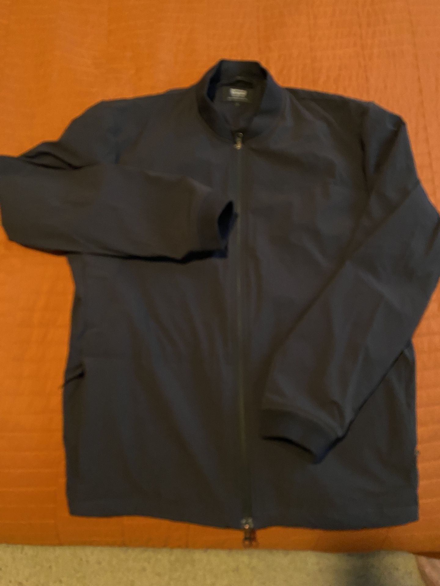 Nice Levi’s black jacket zippers on hand pockets & on the back to carry item. Reflective symbol.  Size Large. 