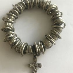 Silver color bracelet with cross