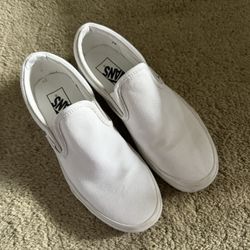 All white slip on vans 