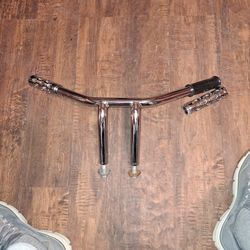 MOTORCYCLE DRAG BARS 7" BUILT IN RISERS,  I'LL THROW IN THE GRIPS. WILL FIT HARLEYS