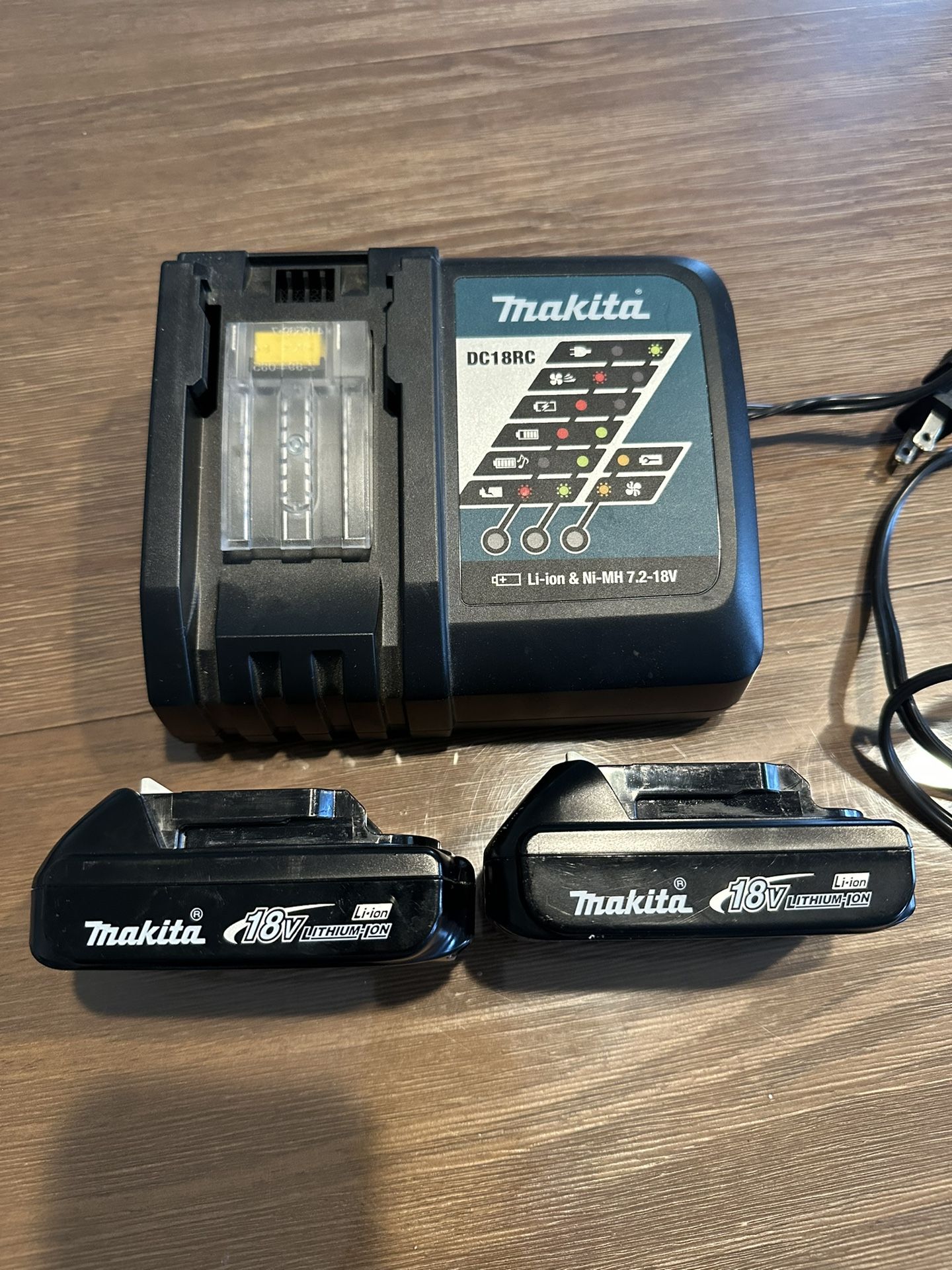 Makita Charter And Two 18v Batteries