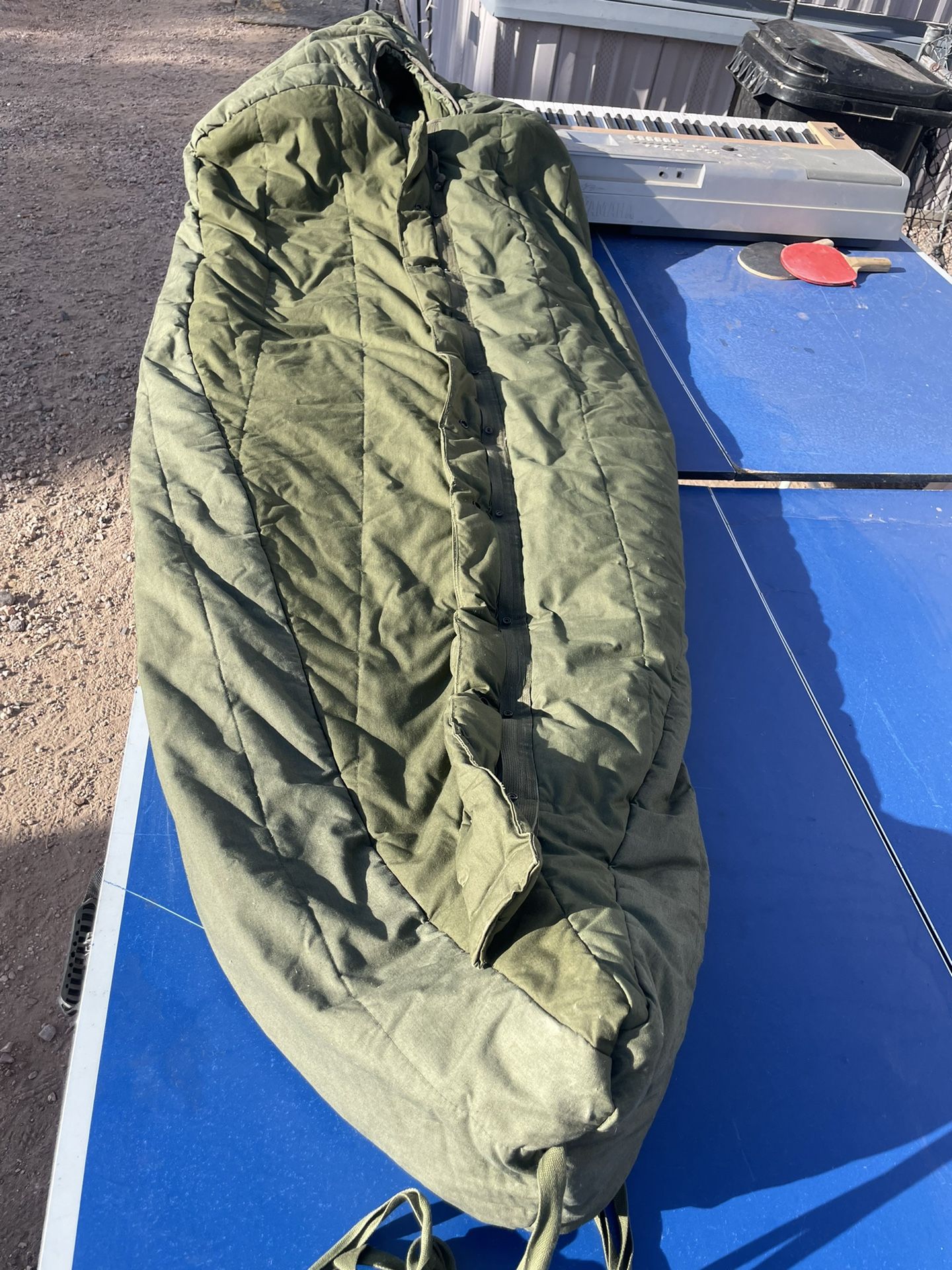 Intermediate, cold-weather, sleeping bag with hood
