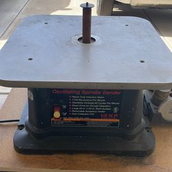 Oscillating spindle sander