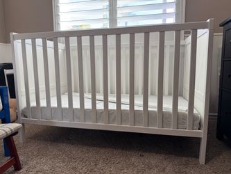 White crib and mattress
