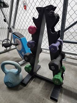 Folding Stationary Exercise Bike plus Fitness accessories.

Gray and blue folding stationary exercise bike with padded seat, handlebar grips, and peda