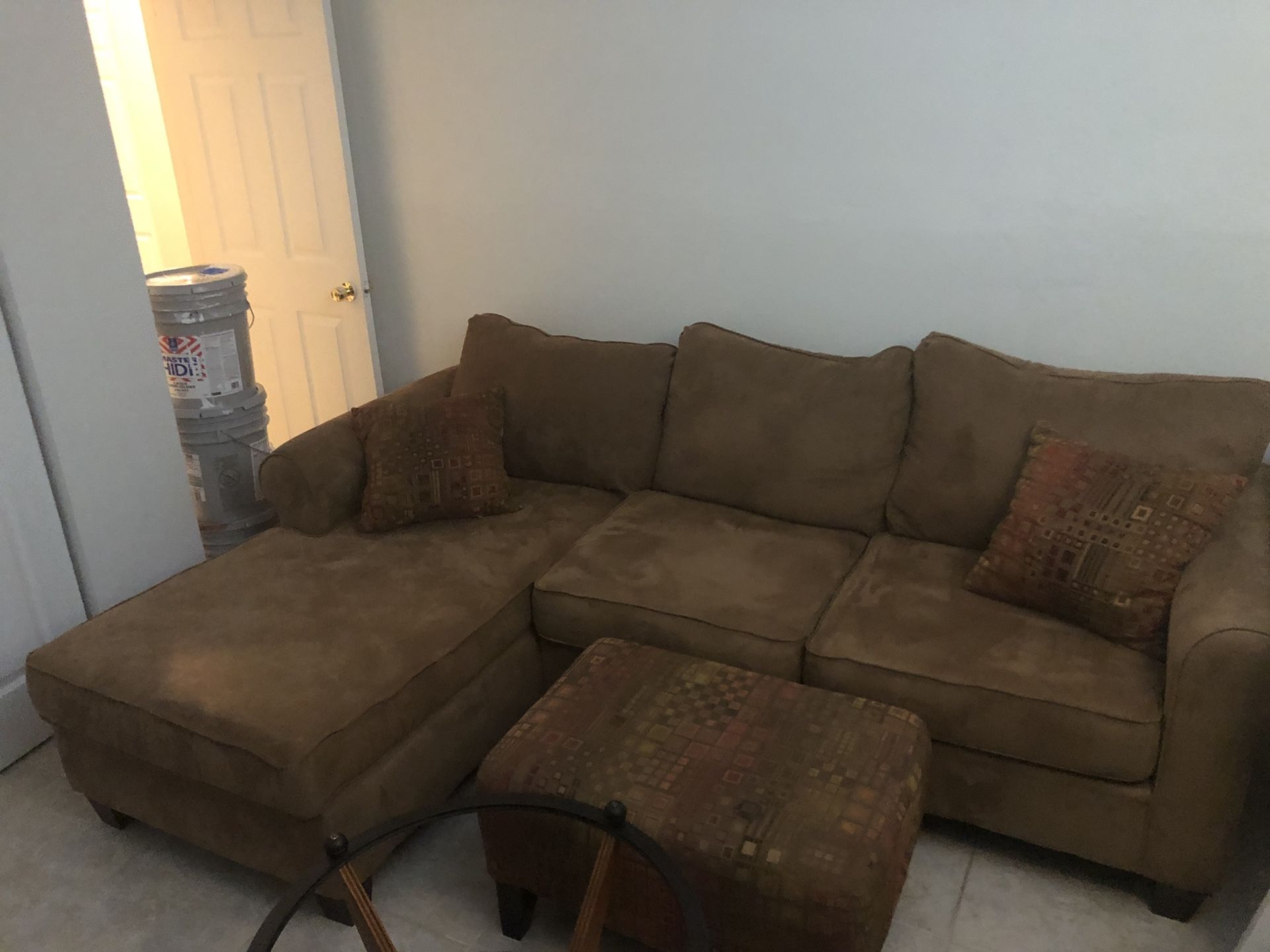 Living room set with ottoman, coffee table, and end table