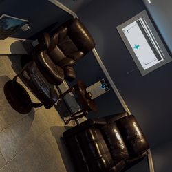 Leather reclining chairs, one plugs in 120v outlet with button on side