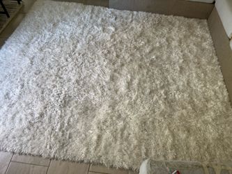 Bob’s furniture big white fur carpet