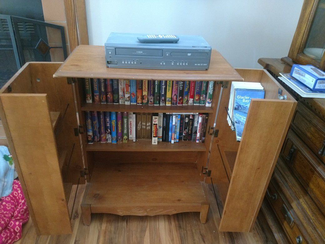Disney VHS collection, movie cabinet, and VHS/DVD player