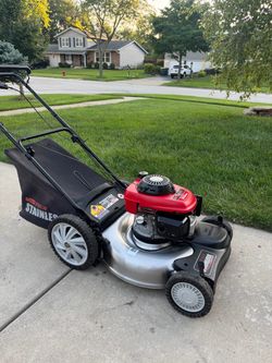 MTD-Honda Pro self-propelled lawn mower features a durable stainless steel deck.
