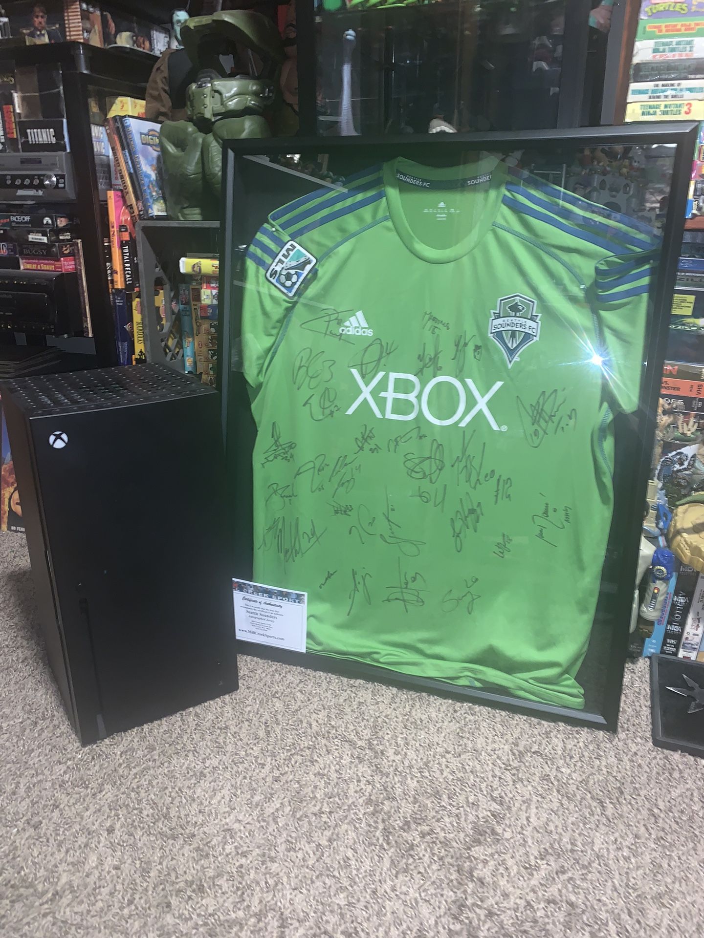 Autographed, Xbox sounders jersey, and Xbox mini fridge