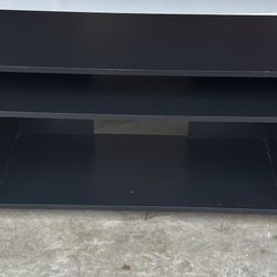 “Modern Black TV Stand - Great Condition, Perfect for Your Living Room!”
