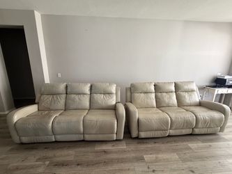 Cream leather reclining sofas