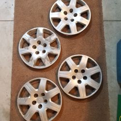 2006 Honda Civic OEM hubcaps set of 4 - 7 Spoke