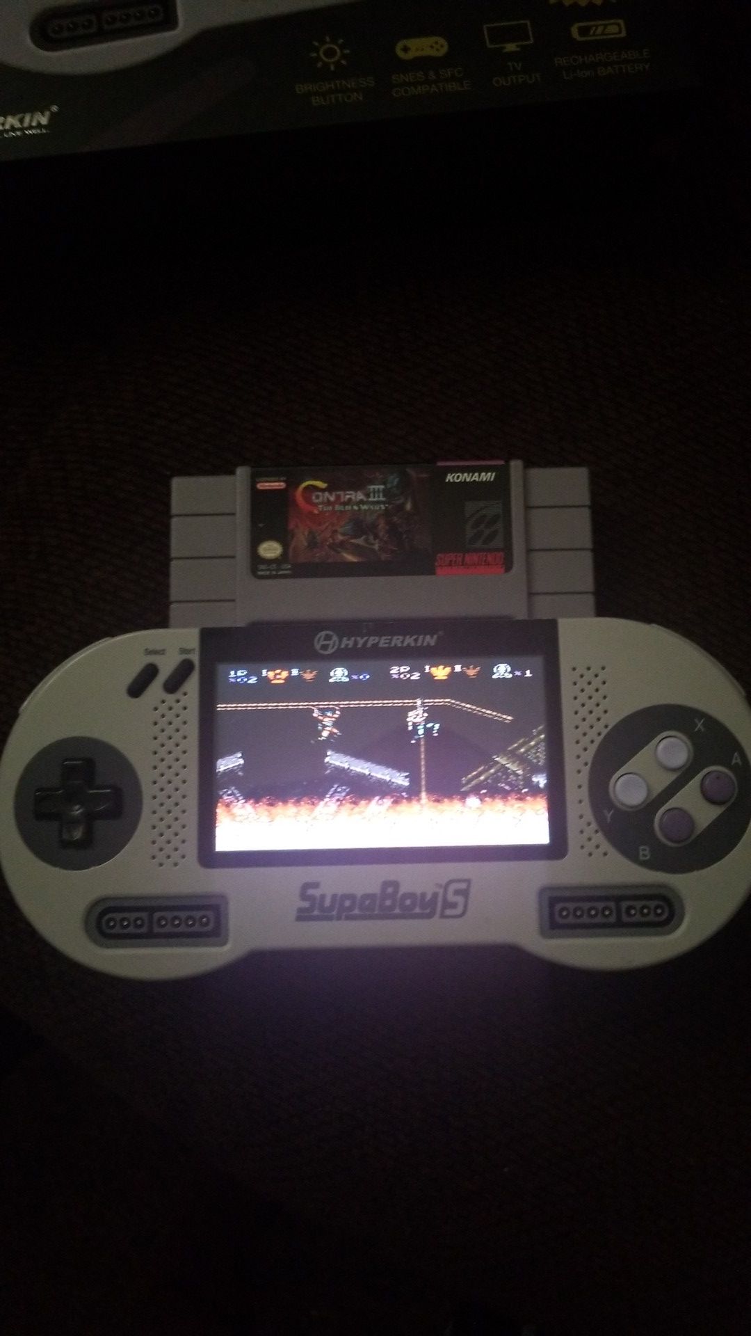 Supaboy S handheld super Nintendo console with contra 3