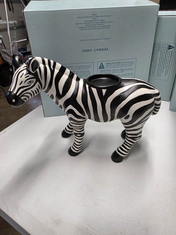 Partlite P9146
AFRICAN INSPIRATIONâ„¢ ZEBRA VOTIVE HOLDER