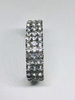 Silver tone bracelet with rhinestones