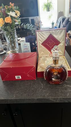 Louie XIII Cognac in original baccarat Numbered 4058 bottle and Rémy Martin case and box