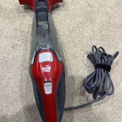 Red Dirt Devil handheld vacuum with cord. 