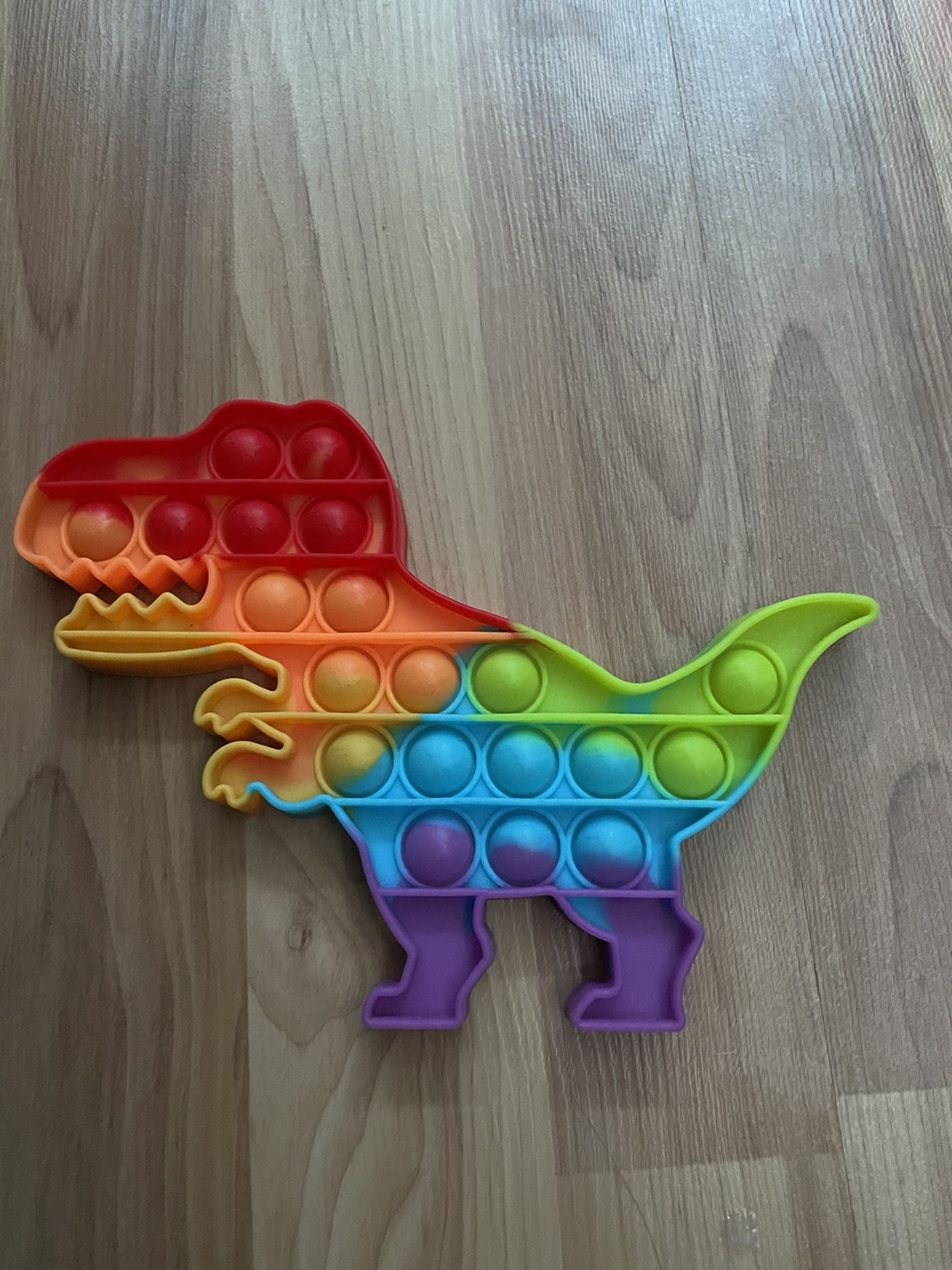 Rainbow dinosaur pop it