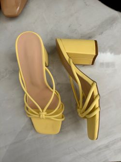 Yellow block heel sandals with a boho vibe