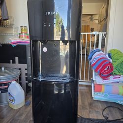 Primo Water dispenser and extra 5 gal bottles