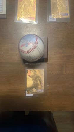 A gold card 70 home run Mark McGuire trading card
