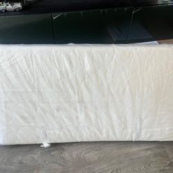 Like-new crib mattress, in bag.