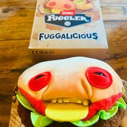 The Hamburger Fuggler, officially named Urga Burga, is a 9-inch plush from the food-Fuggalicious