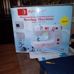 M.G.T.+G.C.C. MICROCOMPUTERIZED MULTIFUNCTIONAL SEWING MACHINE 