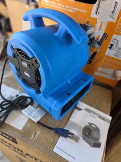 Blue compact air mover with a built-in carry handle, rear intake vent, and power cord. Good condition with no visible damage.
