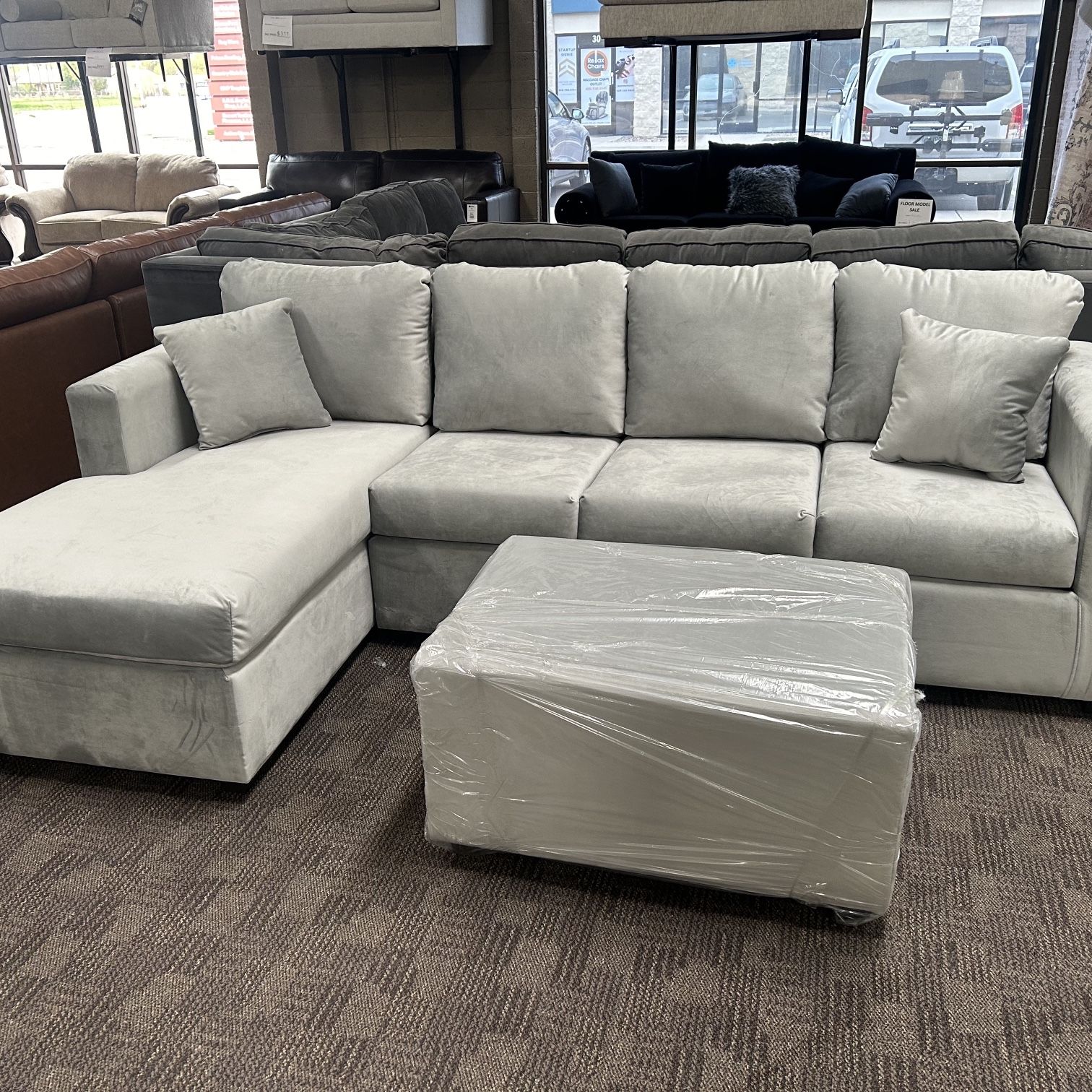 New Grey Sectional And Ottoman