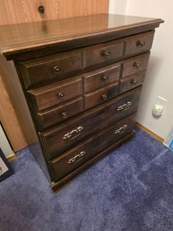 Dark Wood Tall Dresser with Multiple Drawers