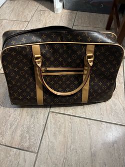 Louis Vuitton luggage/ duffel bag